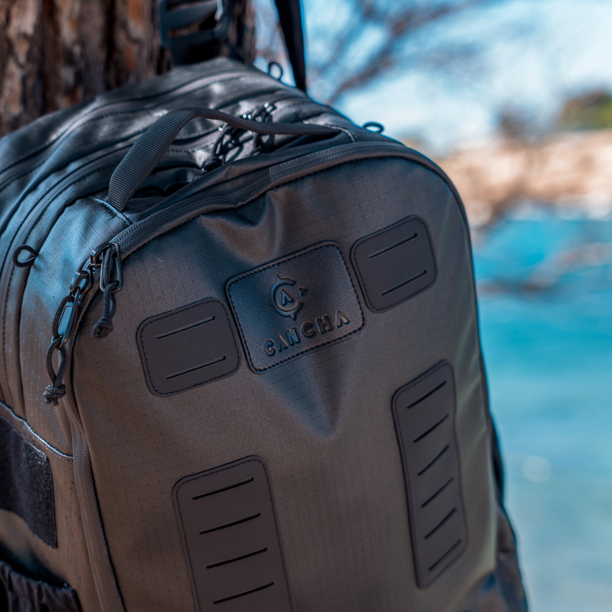 Backpack with visible brand logo against a natural background