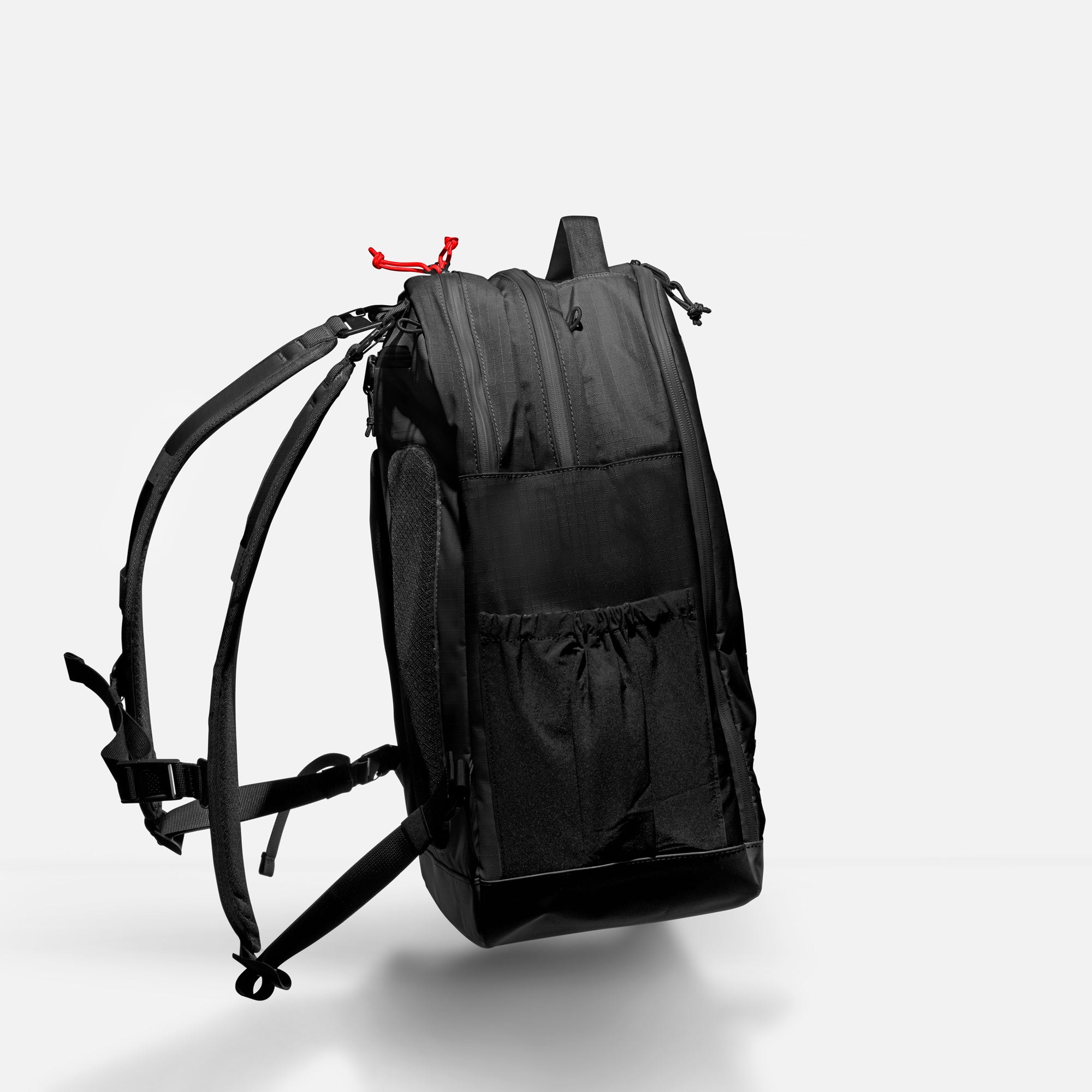 Black backpack on a light gray background